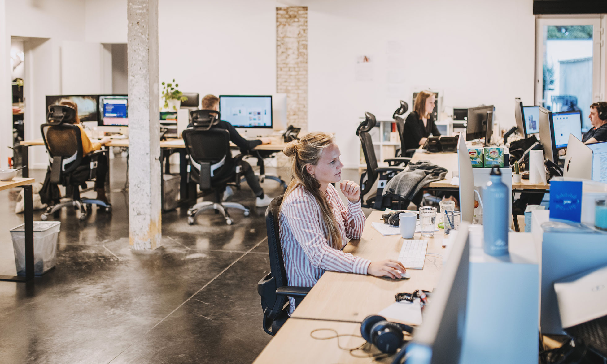 Employees at work in the Esign office